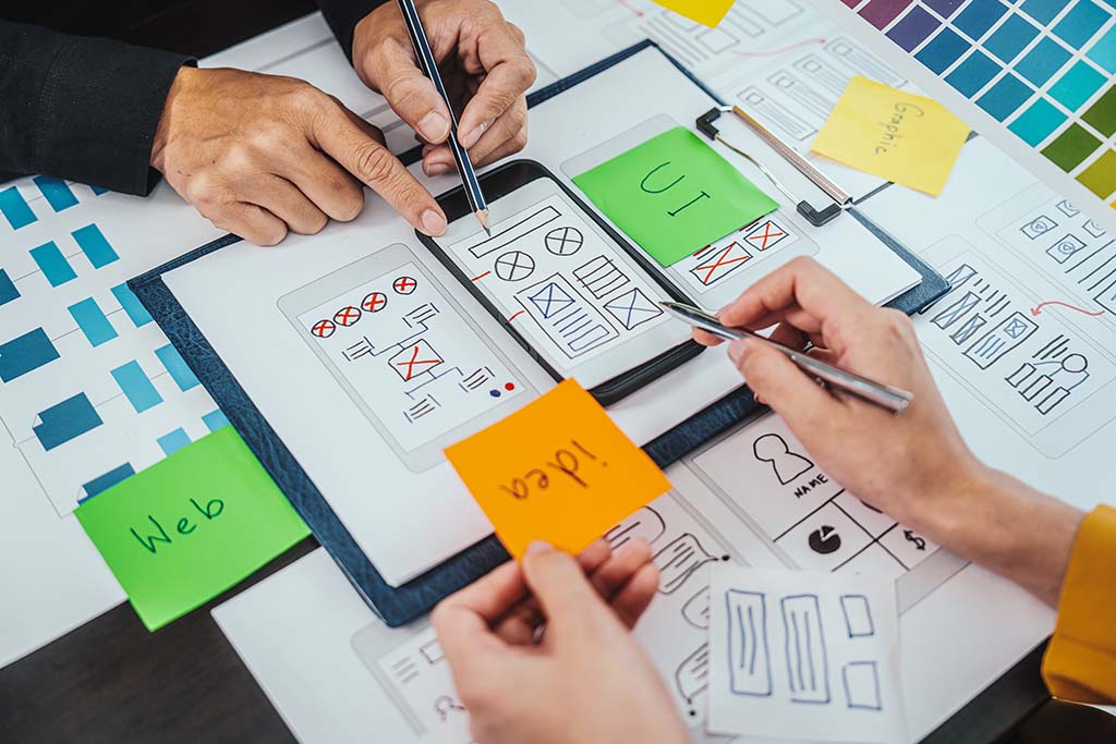 UI/UX designers and developers planning a mobile app layout